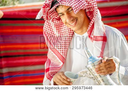 Arbic boy pouring coffee