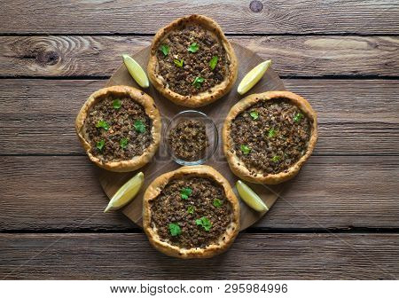 Arabic Meat Sfiha Over A Wooden Table. Top View Of Arabic Esfiha.