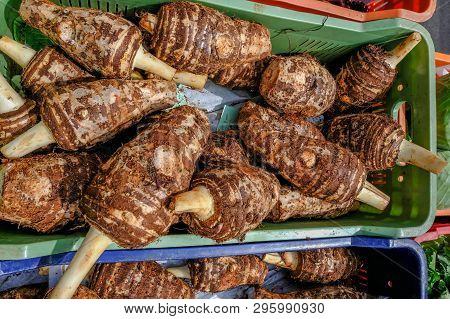 Selection Of Root Vegetable Taro On A Market Stall In Cyprus.