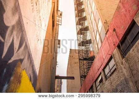 Johannesburg / South Africa - November 19 2016: An Alleyway Between Tall Buildings