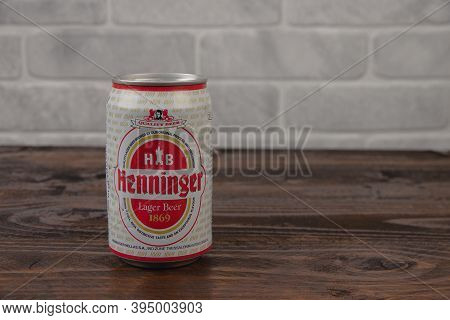 An Old Aluminium Can Of Henninger Beer Against The Brick Wall