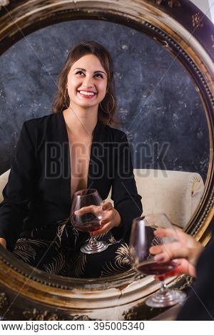 Beautiful Young Lady In Black Jacket Sitting Afront Of The Vintage Mirror With Glass Of Wine Studio 