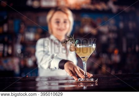 Girl Barman Concocts A Cocktail At The Brasserie