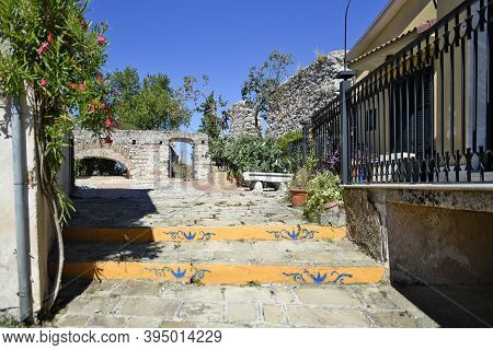 A Narrow Street Among The Old Houses Of Grumento Nova, A Medieval Village In The Basilicata Region, 