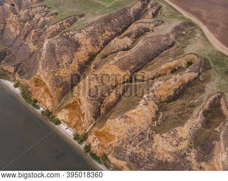 Aerial Shot Of Clay Hills With Canyons Near The Black Sea At Misty Autumn Weather. Stanislavs Mounta