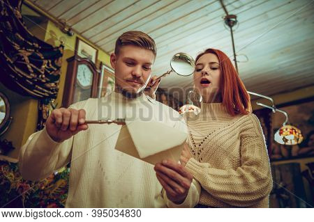 Waxed Envelope. Smiling Family, Couple Looking For Home Decoration And Holidays Gifts In Household S