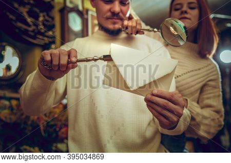 Waxed Envelope. Smiling Family, Couple Looking For Home Decoration And Holidays Gifts In Household S