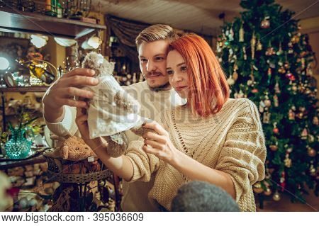 Handmade. Smiling Family, Caucasian Couple Looking For Home Decoration And Holidays Gifts In Househo
