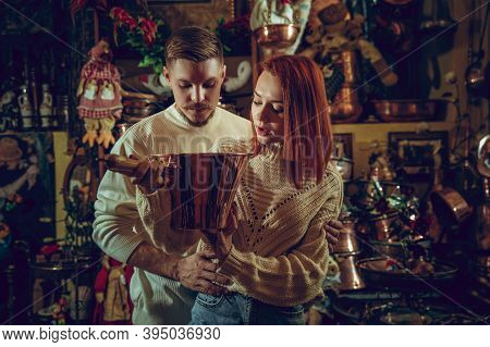 Golden. Smiling Family, Caucasian Couple Looking For Home Decoration And Holidays Gifts In Household