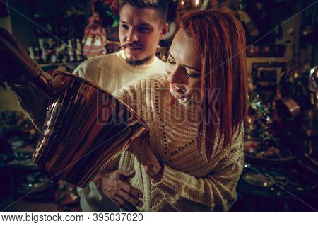 Golden. Smiling Family, Caucasian Couple Looking For Home Decoration And Holidays Gifts In Household