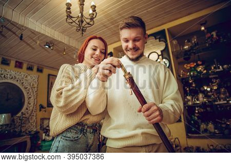 Having Fun. Smiling Family, Caucasian Couple Looking For Home Decoration And Holidays Gifts In House