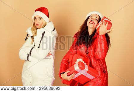 They Love Christmas. Family Vacation. Women In Down Jacket. Girls Santa Claus Hat. Christmas Fashion