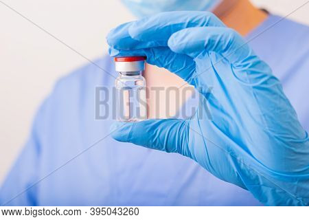 Covid-19 Vaccine Disease Preparing, Doctor Or Scientist Holding Liquid Vaccines.
Concept Fight Again