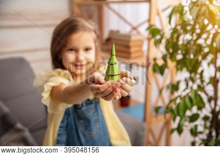 Presenting. Happy Children, Girl Having Fun In Creativity Of The House. Happy Kid Makes Handmade Toy