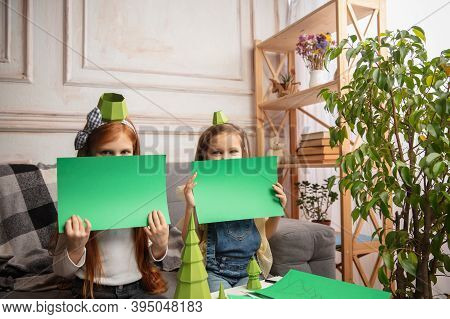 Playful. Two Little Children, Girls Together In Creativity Of The House. Happy Kids Make Handmade To