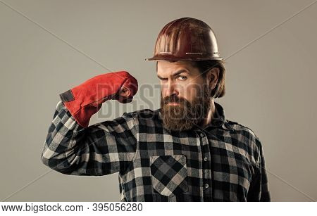 He Is Strong. Industrial Worker In Helmet. Man In Gloves. Construction Worker In Hard Hat. Engineer 