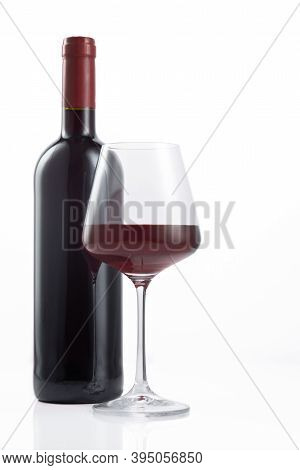 Bottle And Glass Of Spanish Red Wine On  White Background