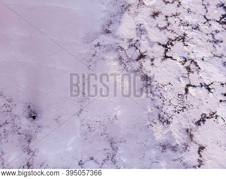 Amazing Forms Of Land Surface Made Of Water And Salt, Nature Abstract Background, Aerial View. Pink 