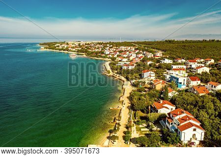Aerial Top View Of Village Petrcane, Croatia. Touristic Background With Blue Sea, Coastline And Red 