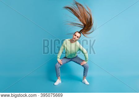 Photo Portrait Of Serious Girl Twerking Waving Hair Isolated On Pastel Blue Colored Background
