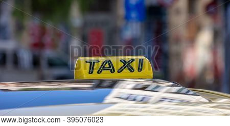 Taxi Sign Yellow Color Detail, Defocused City Street Background