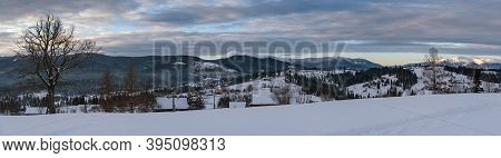 Small Alpine Village And Winter Snowy Mountains In First Sunrise Sunlight Around, Voronenko, Carpath