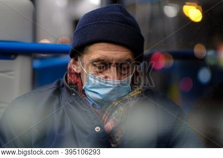 Moscow. Russia. November 16, 2020. A Man In A City Bus Wearing A Protective Medical Mask. Preventive