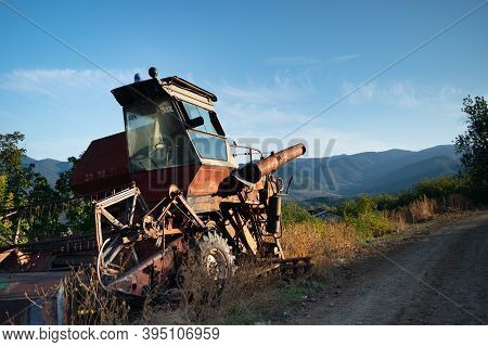 Old Abandoned Rusty Combine Harvester On The Streets Of Azokh Town Part Of The Janapar Trail In Nago