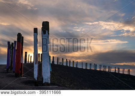Bottrop, Germany - December 31, 2020: Totems On Haniel Tip, Landmark Of Ruhr Metropolis Against Rain
