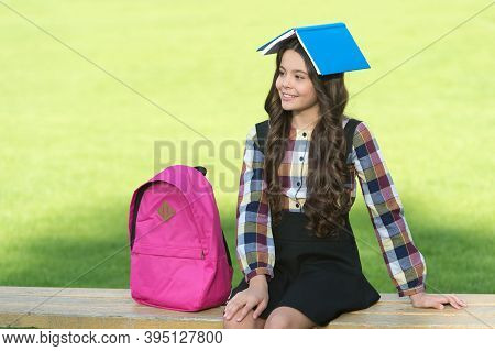 Fun Filled Learning. Funny Child Hold Book On Head. School Library. Reading Education. Knowledge And