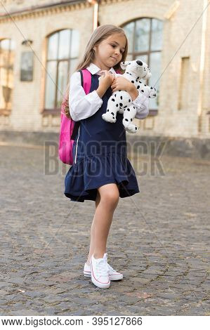 Playing Is New Skill. Little Child Cuddle Toy Dog Outdoors. Playschool And Afterschool. Educational 