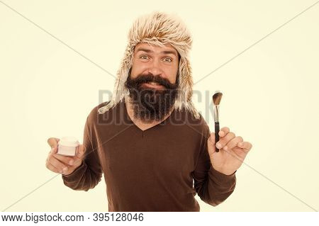 Man Bearded Fashion Stylist Wear Hat Hold Brush For Applying Makeup. Eccentric Guy With Beard. Makeu