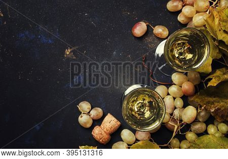 Champagne In Glasses, Grapes With Vine, Black Background, Top View