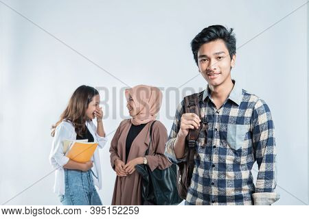 Portrait Of Happy Young Man University Carrying Bags And Campus Young People Chatting
