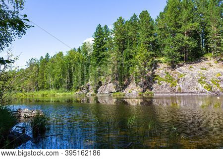 Rocky Shores Of Lake Tagasuk. Siberia, Russia