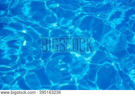 Blurred Focus. Swimming Pool Water Texture In Abstract Style On Blue Background. Vacation, Holiday. 