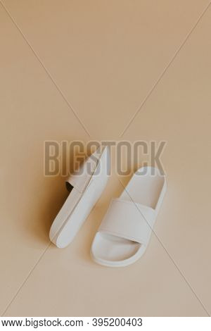 White slide sandal slippers on beige