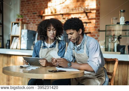Problems, Coronacrisis And Working With Bills During Social Distance Of Covid-19 Pandemic. Sad Young