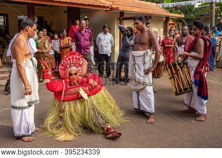 Payyanur, India - December 5, 2019: Theyyam artist perform during temple festival in Payyanur, Kerala, India. Theyyam is a popular ritual form of worship in Kerala, India