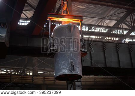 Iron Casting At The Foundry. Overhead Crane With Ladle With Molten Metal At Metallurgical Factory