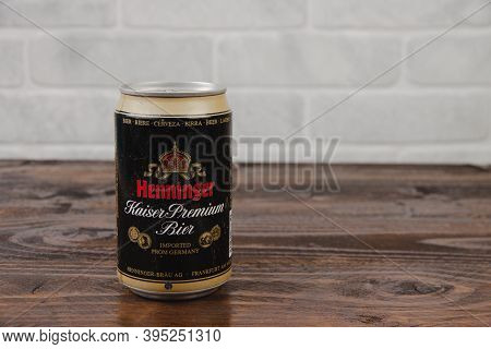A Vintage Aluminium Can Of Henninger Beer Against The Brick Wall
