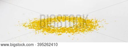 The Fallen Yellow Pollen From The Sunflower Fell On The White Table And Formed A Circle. Selective F
