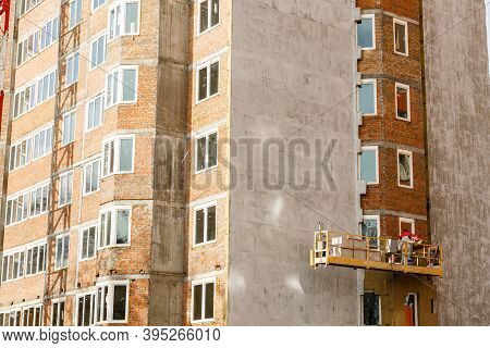 High-altitude Work On The External Walls Of Glass Wool Insulation And Plaster