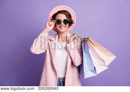 Photo Of Sweet Pretty Optimistic Bob Hair Young Woman Carry Shop Bags Wear Glasses Pink Cap Coat Iso