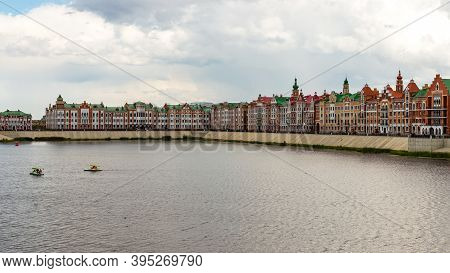 Yoshkar-ola, Mari El, Russia 30 July 2020: Arkhangelskaya Sloboda Quay Bruges Flemmish Houses, Boats