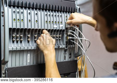 Technician Engineer Fixing Problem With Servers And Data In Cables Room
