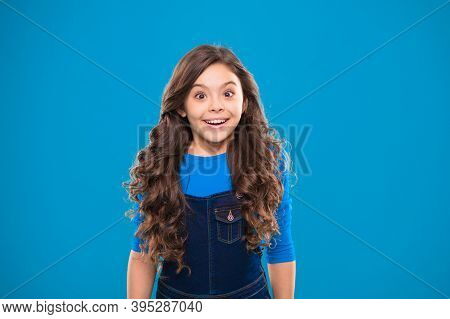Kid Girl Long Healthy Shiny Hair Wear Casual Clothes. Little Girl Excited Happy Face. Kid Happy Cute
