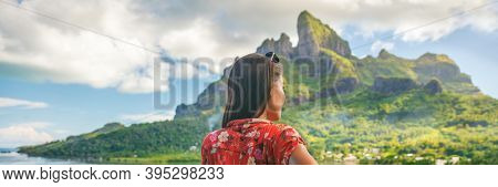 Travel tourist adventure wanderlust influencer girl banner panoramic on Bora Bora island, Tahiti. Woman exploring nature hiking trail in French Polynesia. Mount Otemanu summer background.