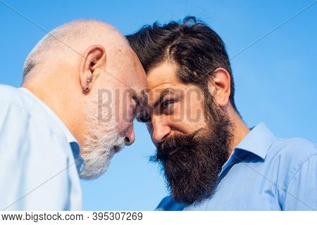Men Generations: Grandfather And Father Together. Elderly Senior Man And Bearded Son - Two Generatio