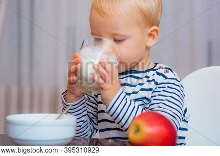 Boy Cute Baby Eating Breakfast. Baby Nutrition. Eat Healthy. Toddler Having Snack. Healthy Nutrition